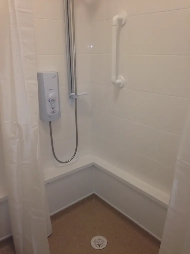 Electric shower and shower tray fitted, the room ready for finishing